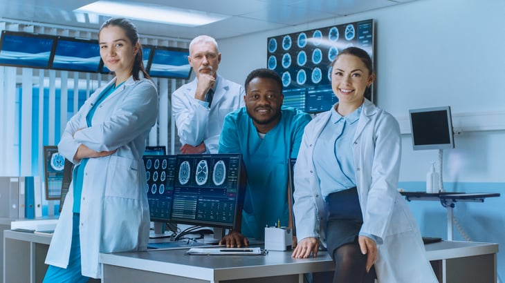 Diverse-Team-of-Medical-Scientist-Posing-with-Crossed-Arms-in-the-High-Tech-Laboratory_-Brain-Sceince--Neurology-Center-Research-Lab-with-Multiple-Dis