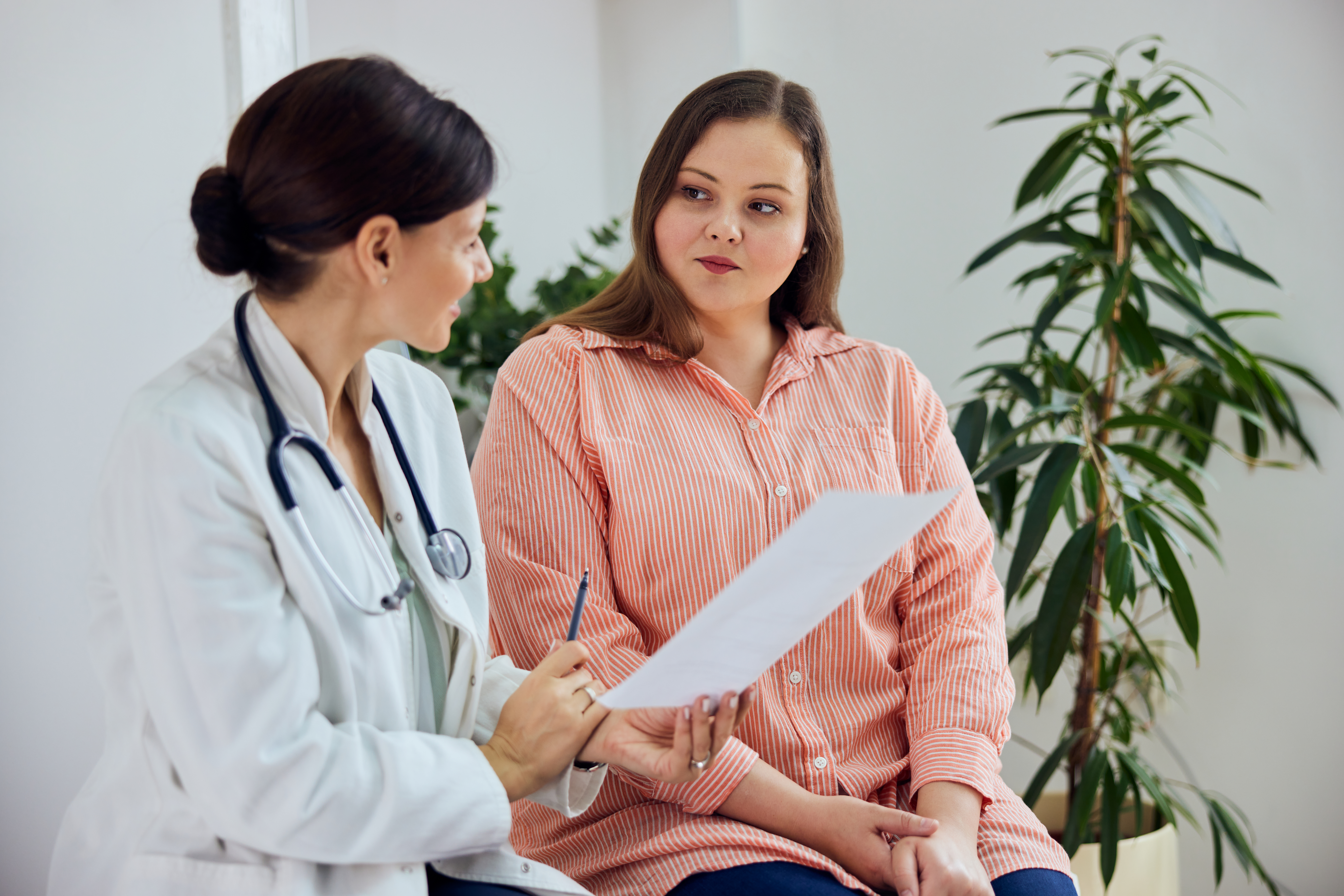 female-european-adult-patients-clinic-talking-about-treatment-web