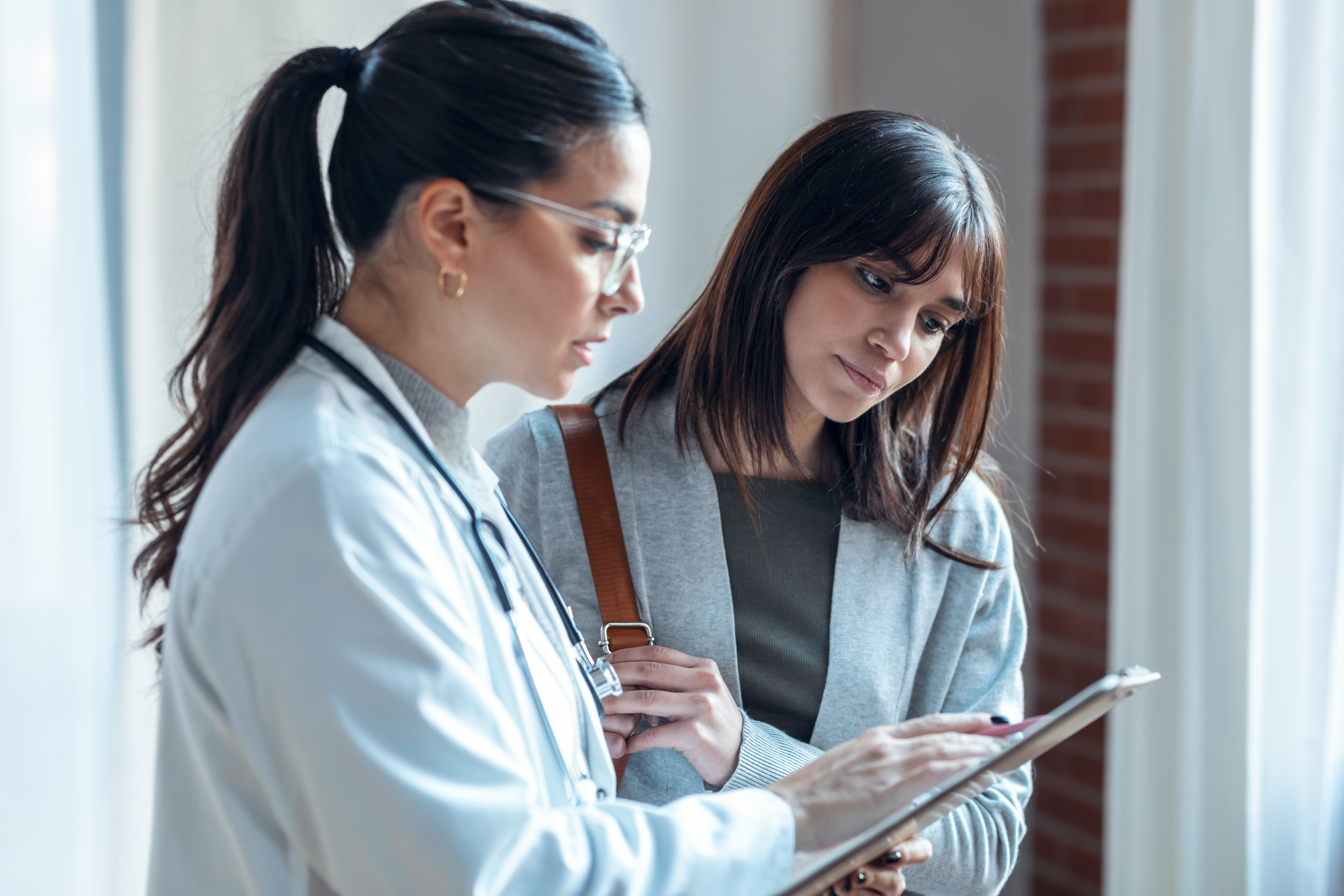 female-latin-american-adult-patients-clinic-explaining-medical-treatment-print-2