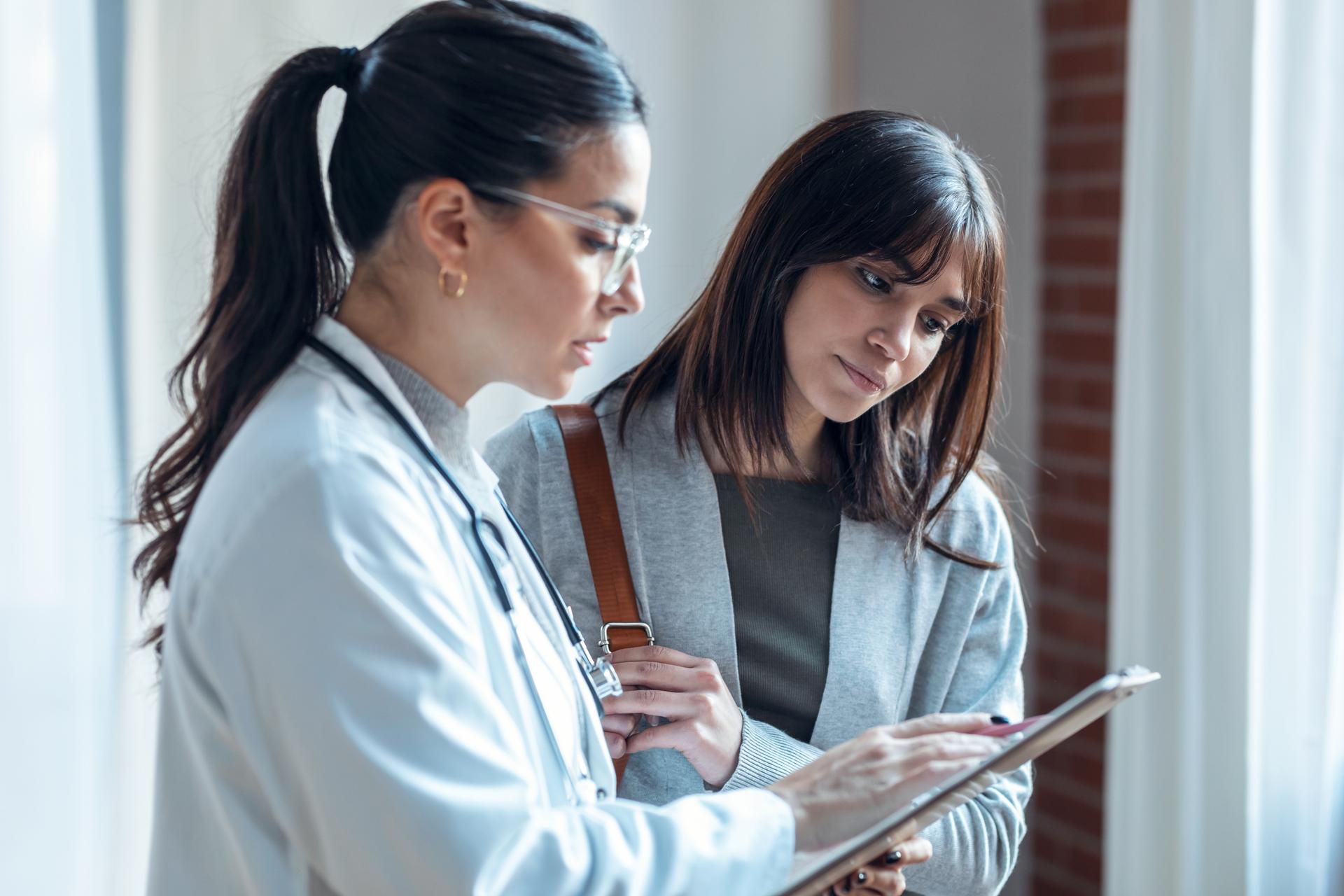 female-latin-american-adult-patients-clinic-explaining-medical-treatment-print